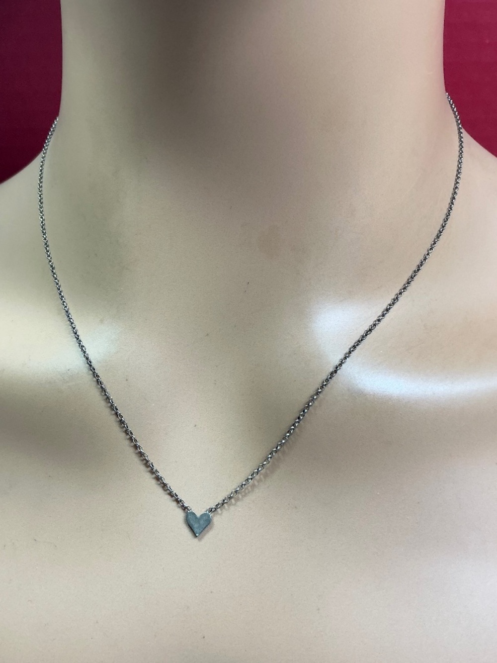 Sterling Silver Petite Rolo Chain With A Stationed Heart Shaped Pendant. 18”